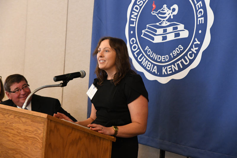  Casey Hardy McGowan accepts her award on Saturday at the 91st LWC National Alumni Association Awards 
