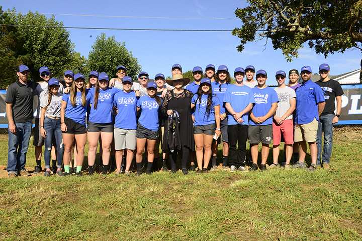 Dr. Jann Aaron poses with the 2017-18 LWC cycling team after the dedication ceremony of the Dr. Phil Aaron Cycling Complex on Sept. 29. The team presented Dr. Jan Aaron with a jersey in memory of Dr. Phil Aaron. The 20-acre property acquisition was made possible in part by contributions by Dr. Jan Aaron, son, Blake and other members of the Aaron family. 